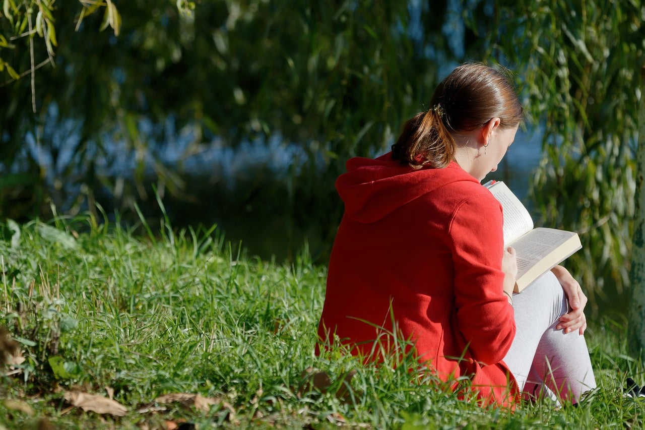 woman, book, grass-6880332.jpg